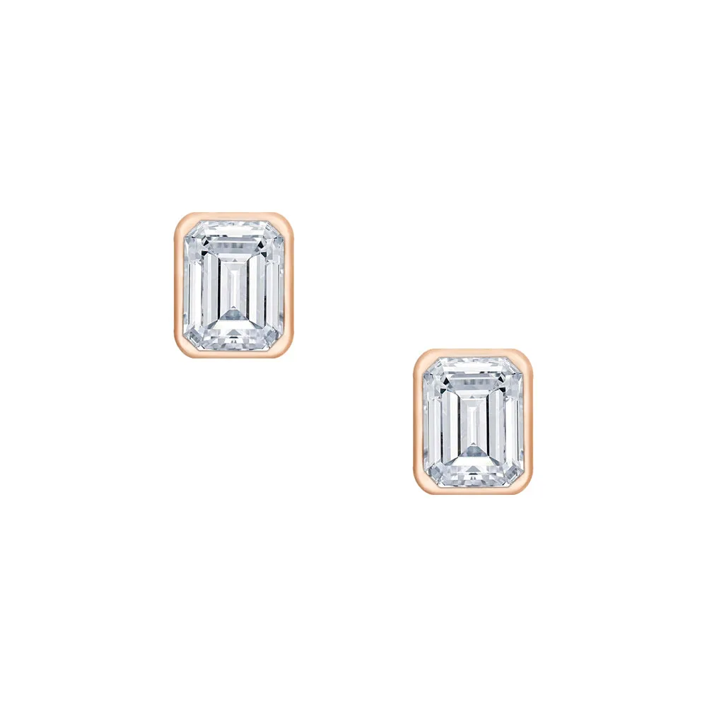 18 Karat .55ct Emerald Cut Bezel Set Stud Earrings