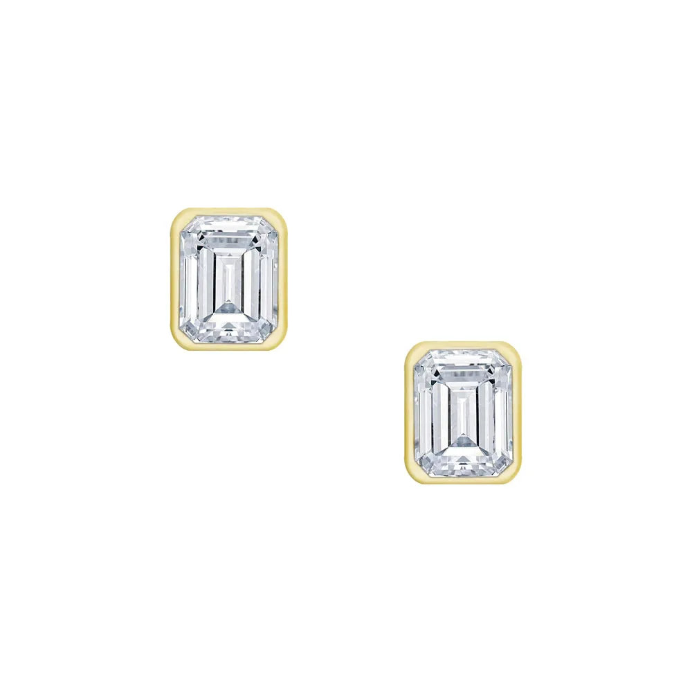 18 Karat .55ct Emerald Cut Bezel Set Stud Earrings