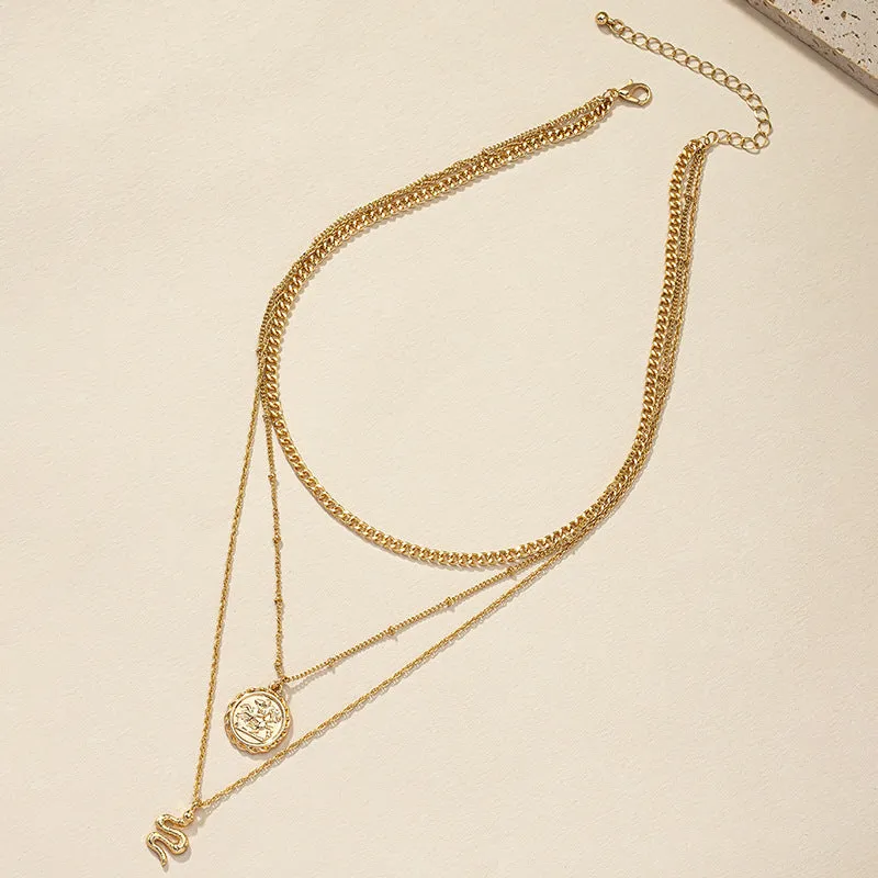 Serpentine Charm Necklace with Stacked Layers and Unique Hanging Tag