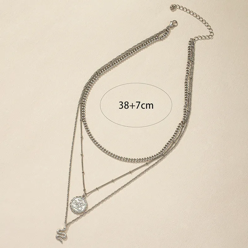 Serpentine Charm Necklace with Stacked Layers and Unique Hanging Tag